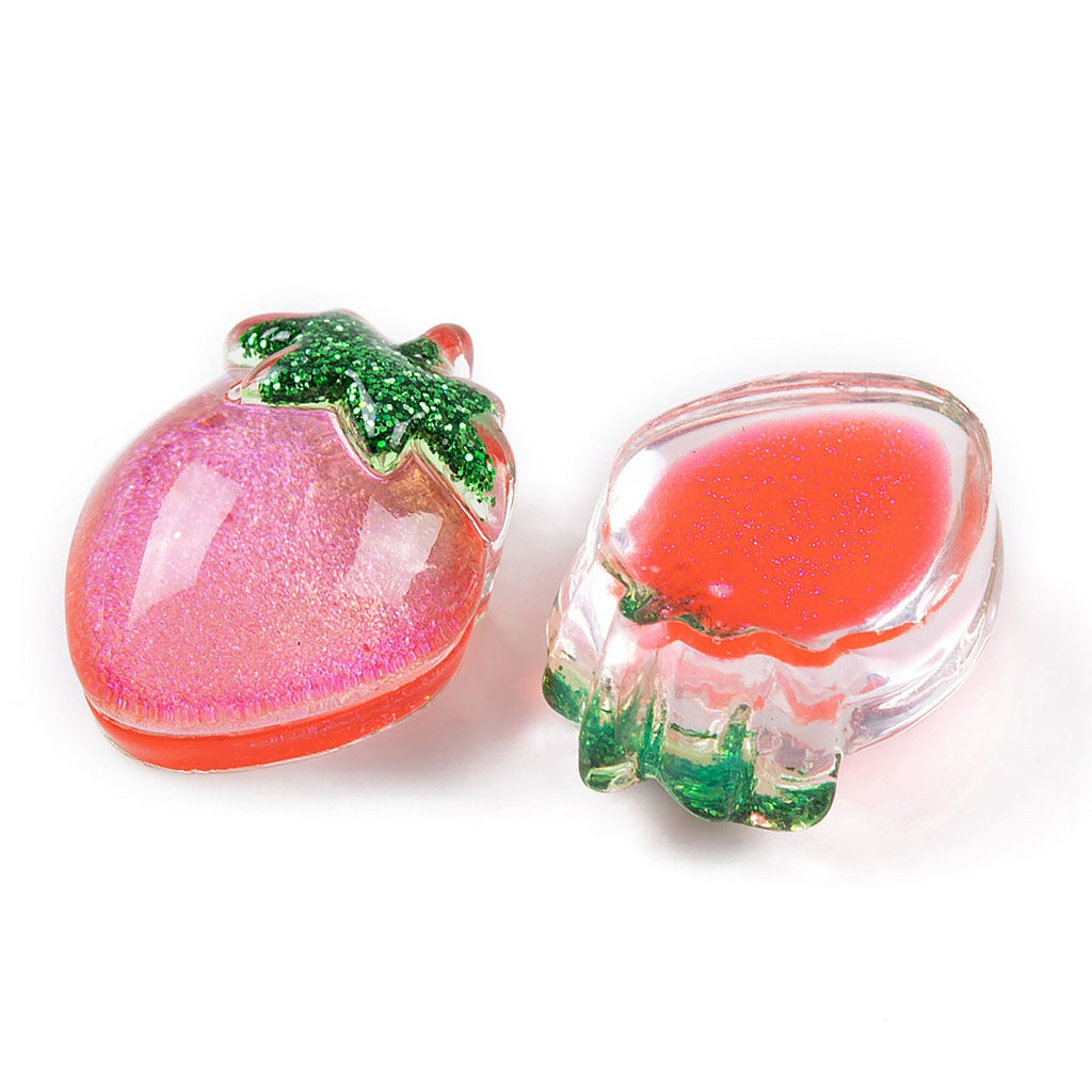 a strawberry and a strawberry shaped soap dish