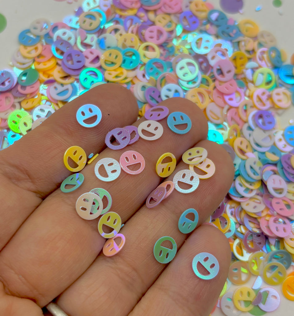 a person is holding a bunch of colorful buttons