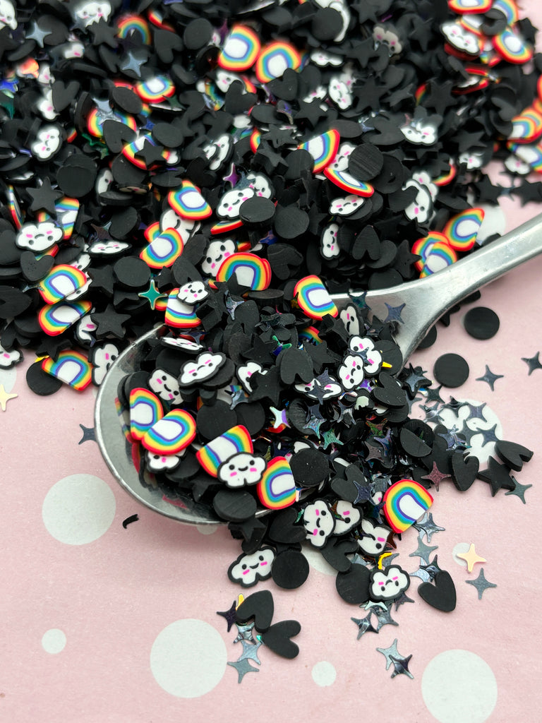 a spoon filled with lots of black and white sprinkles