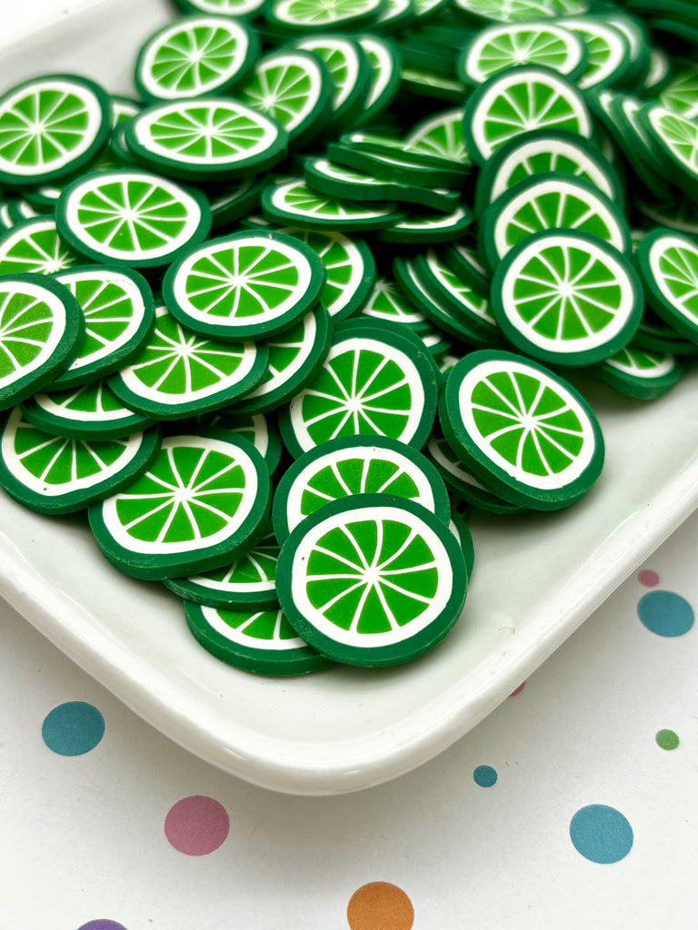 a white plate topped with lots of cut up limes