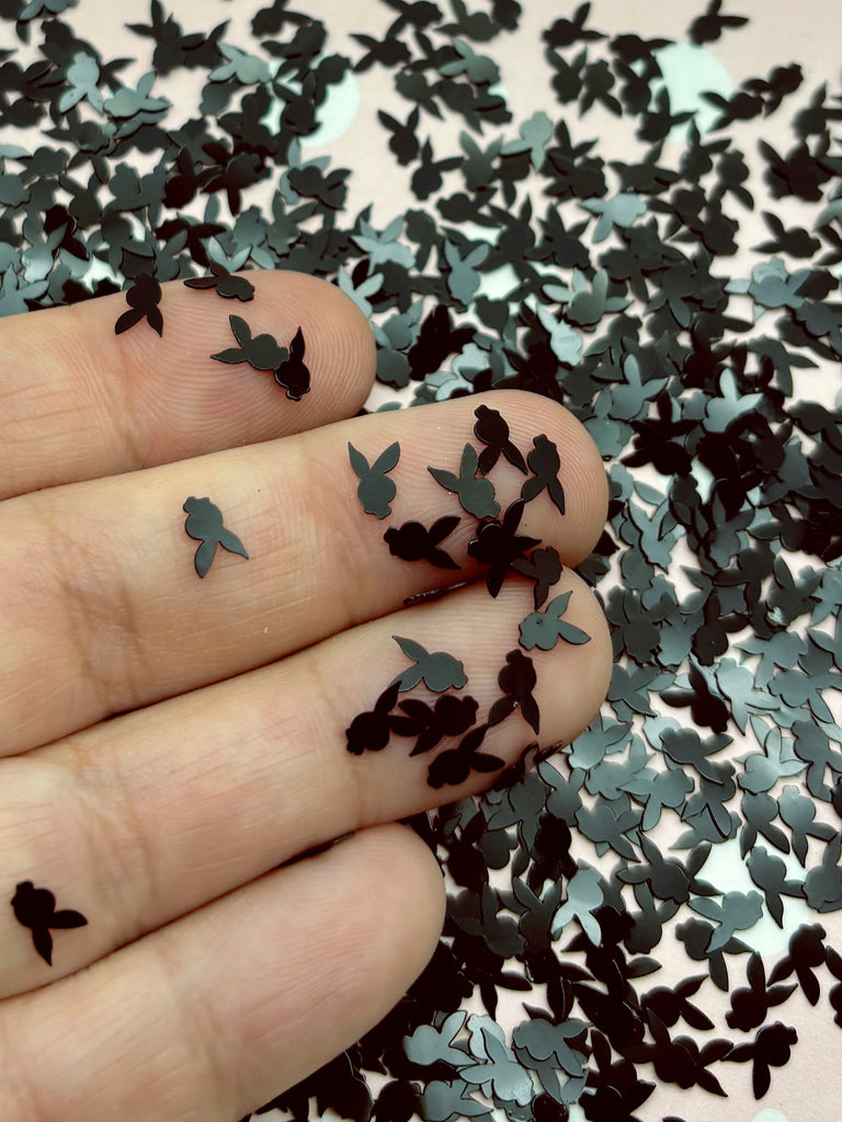 a person's hand with a bunch of butterflies on it