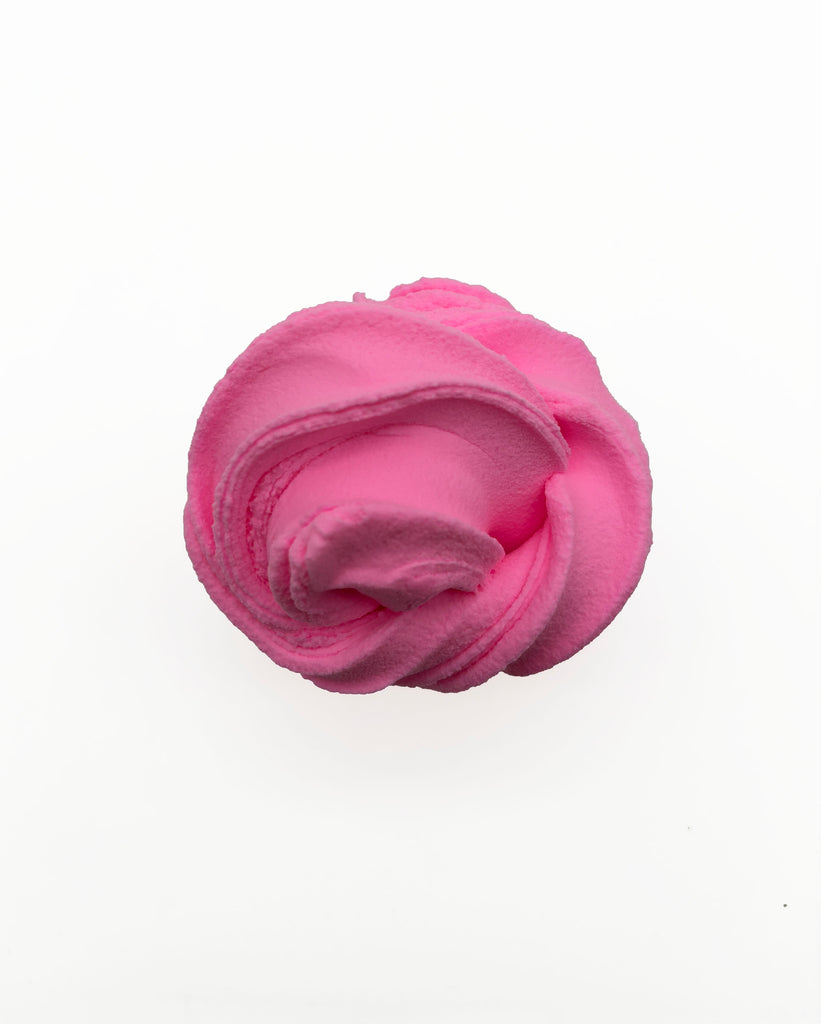 A single, round, pink object is shown against a white background.