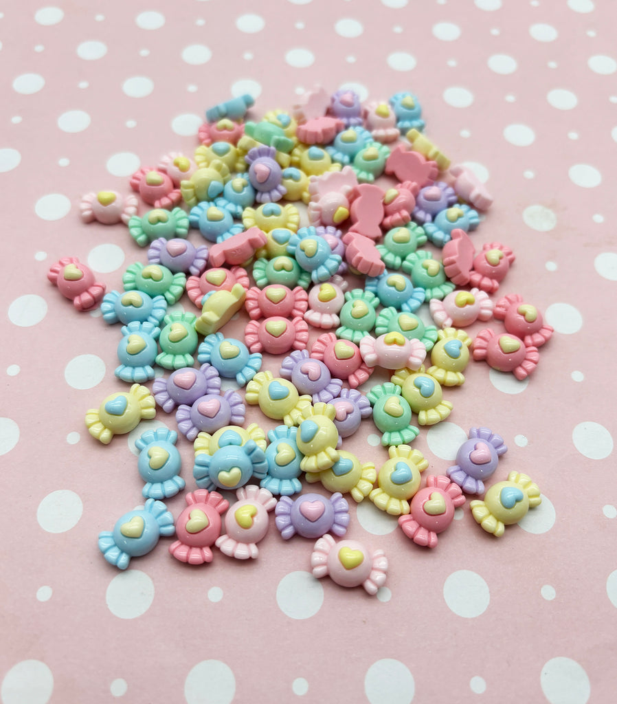 a pile of colorful beads sitting on top of a table