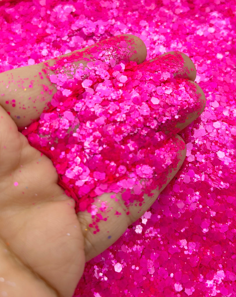 a person holding a pink substance in their hand