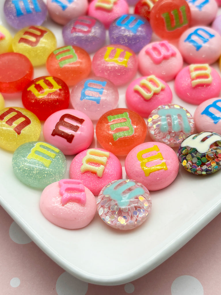 a white plate topped with lots of colorful candies