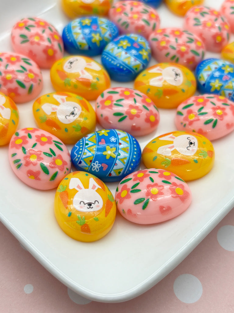 a plate of decorated easter eggs on a table