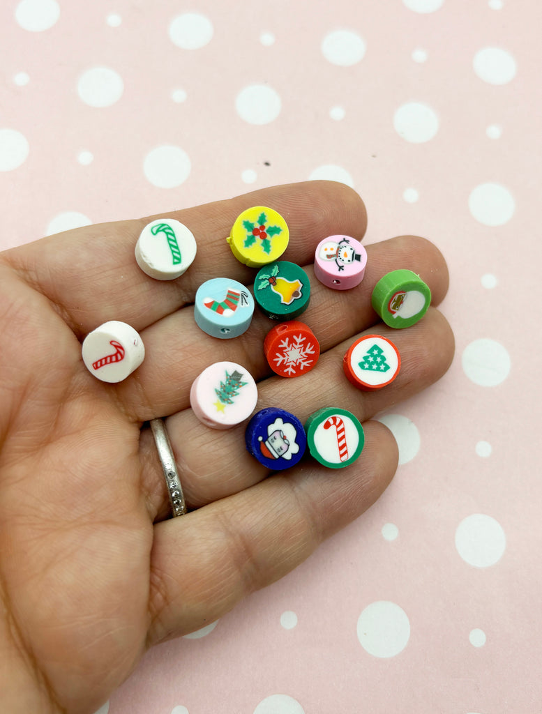 a person holding a bunch of small buttons in their hand