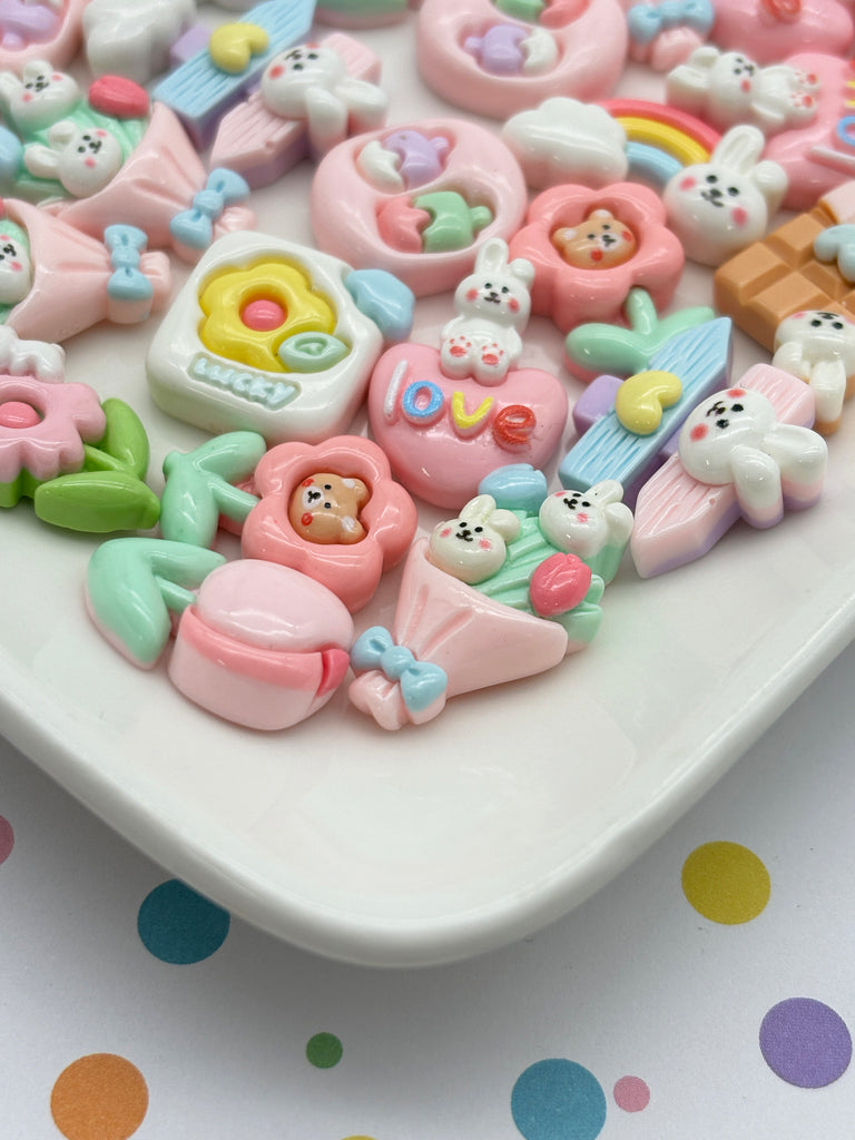 a white plate topped with lots of small toys