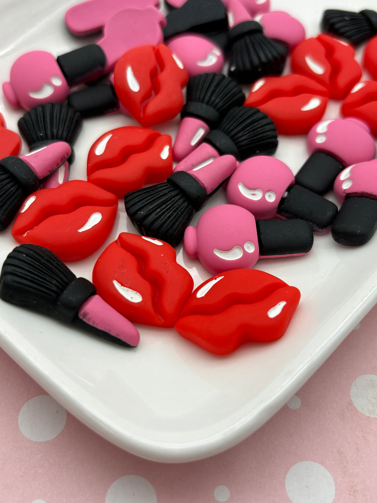 a white plate topped with lots of red and black lips