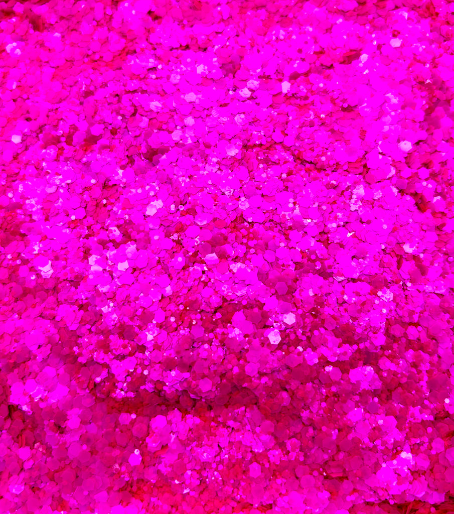 a close up of a bunch of pink glitter