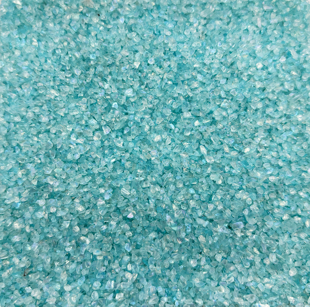 a close up of a blue carpet with small speckles