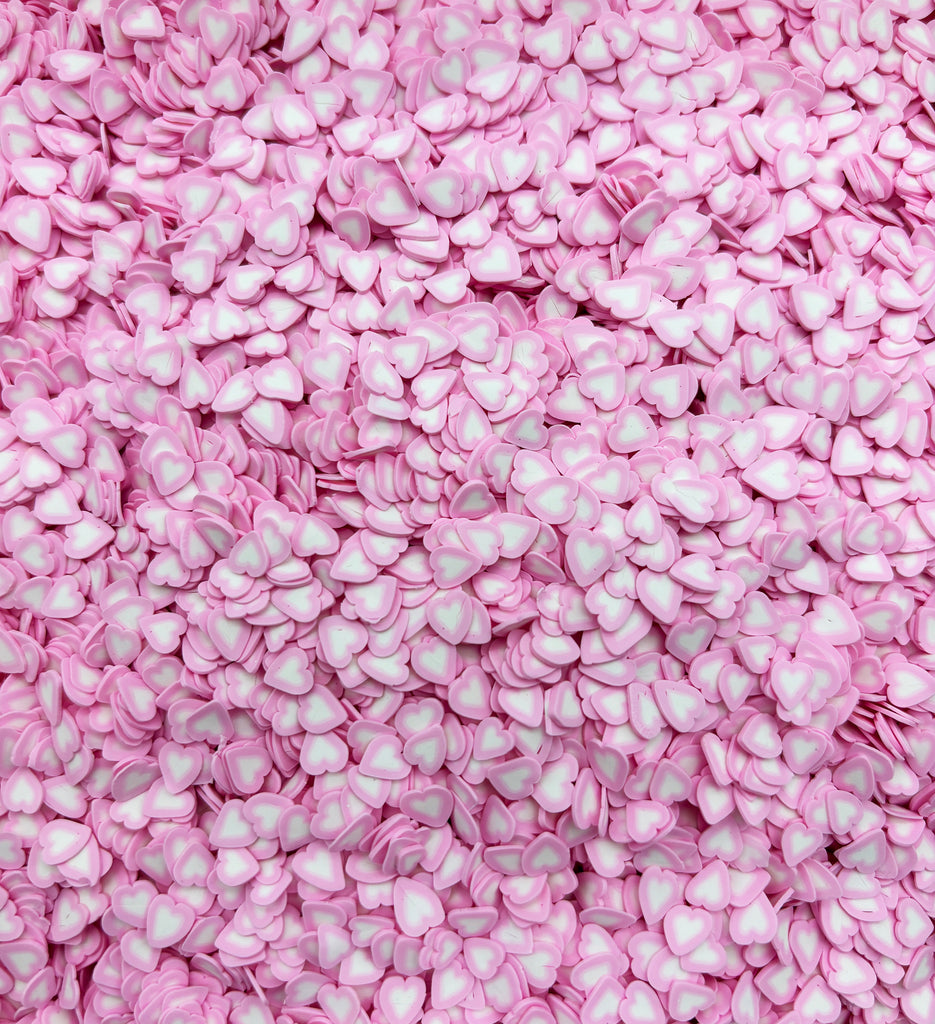 a pile of pink and white candies